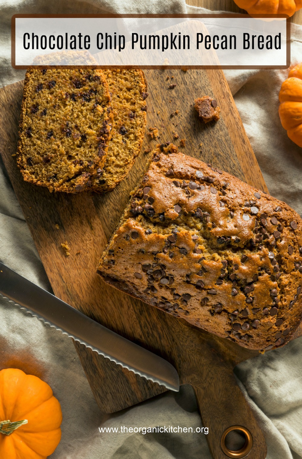 Chocolate Chip Pumpkin Pecan Bread (gluten free option) on wood cutting board surrounded by small pumpkins