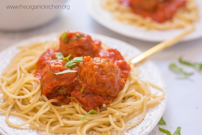 Spaghetti with Homemade Meatballs garnished with basil