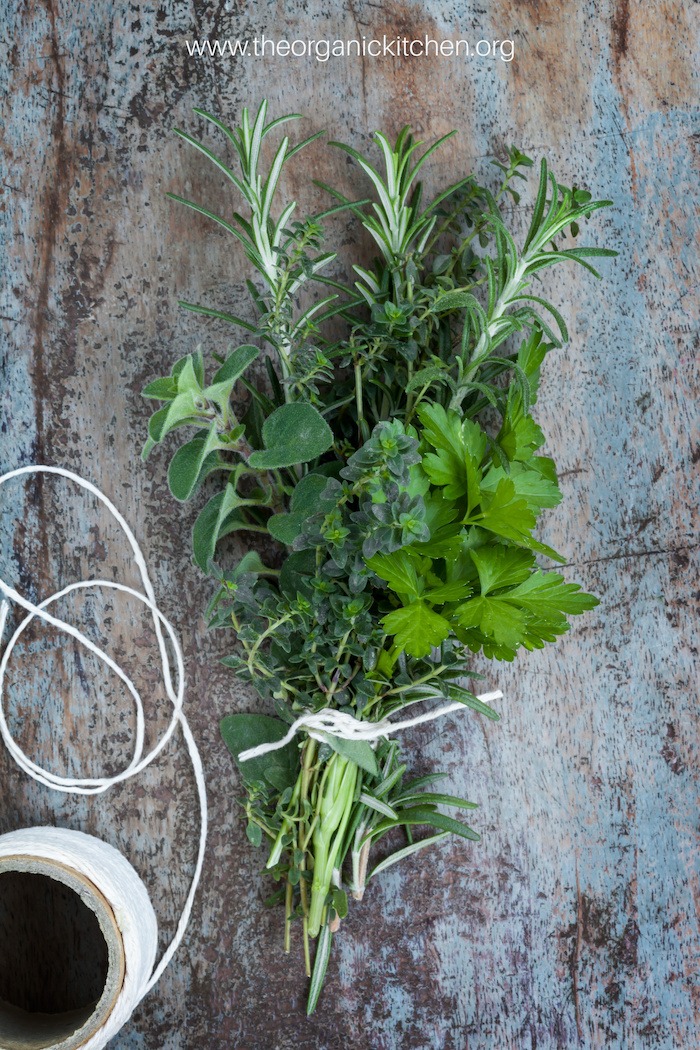 A bundle of herbs tied with string used for making Tender Braised Short Ribs