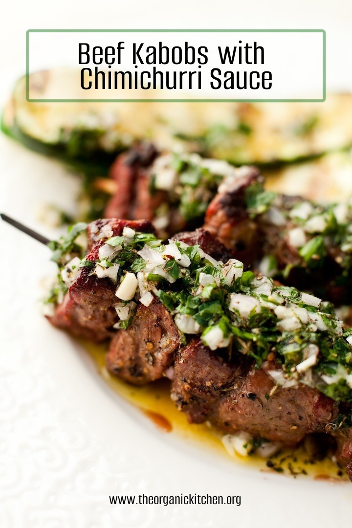 Argentinian Beef Kabobs with Chimichurri Sauce on large white plate