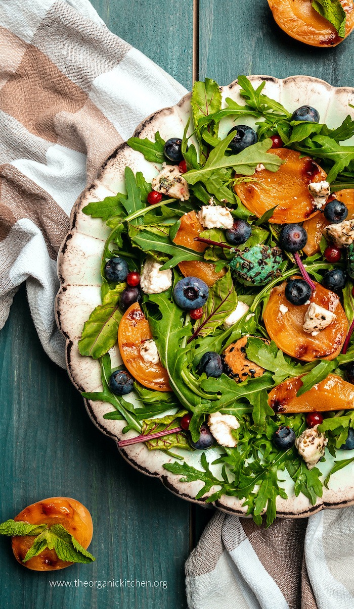 Close up of Grilled Apricot and Blueberry Salad on white plate