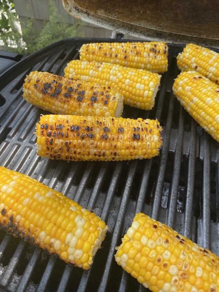 Corn on the cob on the grill for Grilled Corn Summer Salad