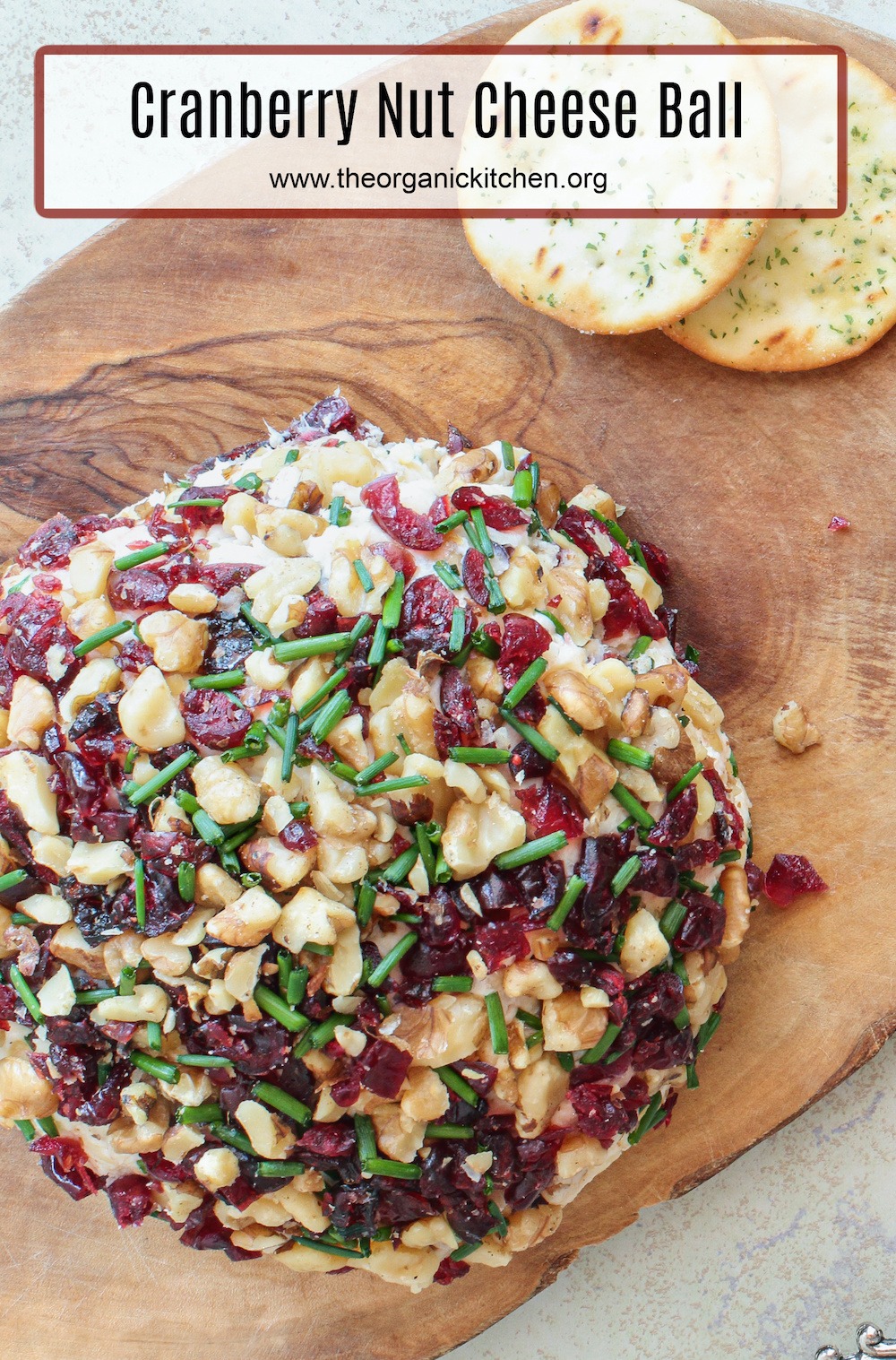 Cranberry Nut Cheese Ball on wooden serving board