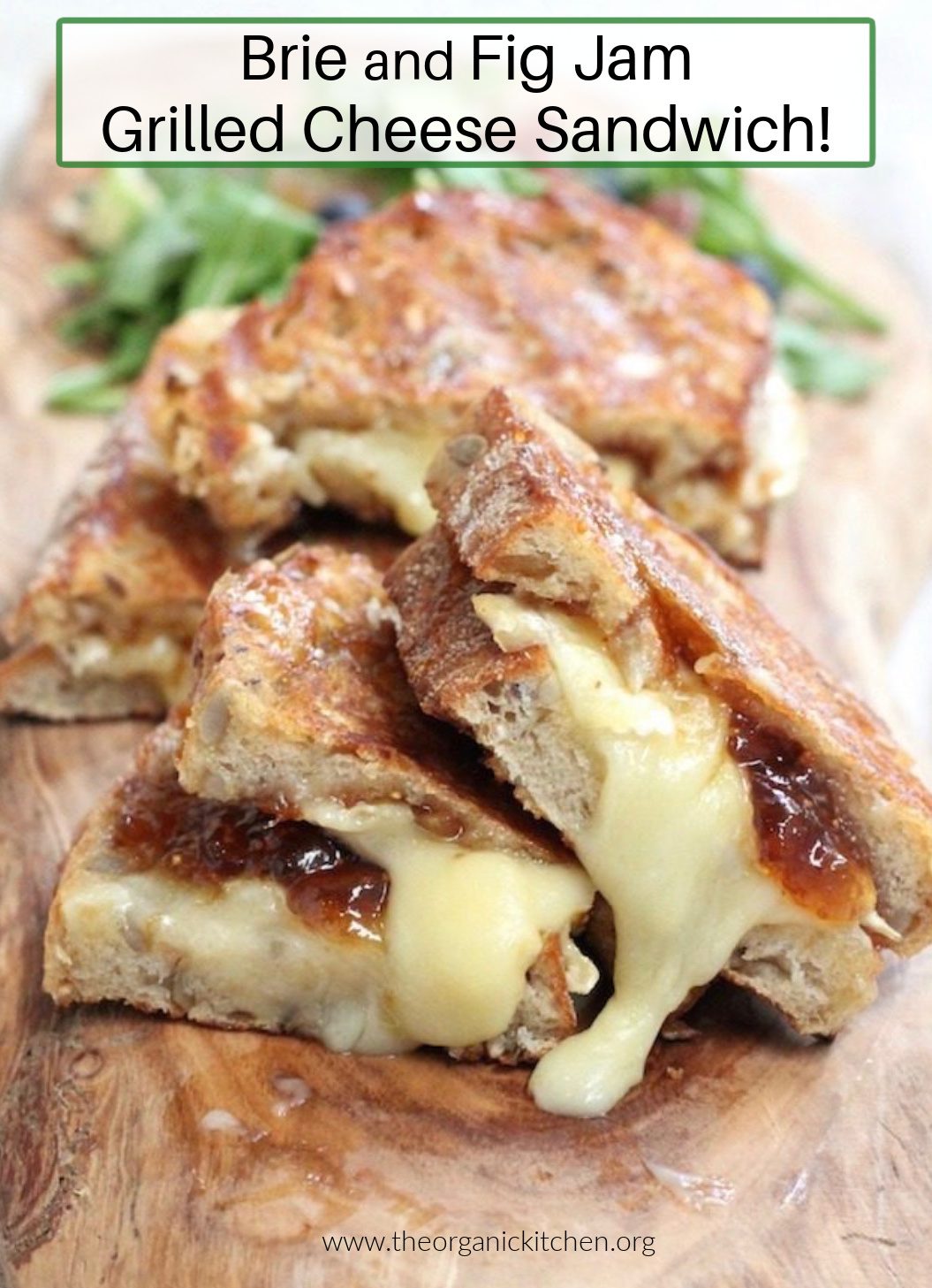 Brie and Fig Grilled Cheese Sandwich A Brie and Fig Grilled Cheese Sandwich on wood board