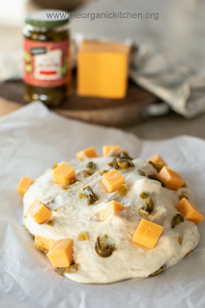 Sourdough with chunks of cheddar cheese and Jalapeno slices before baking