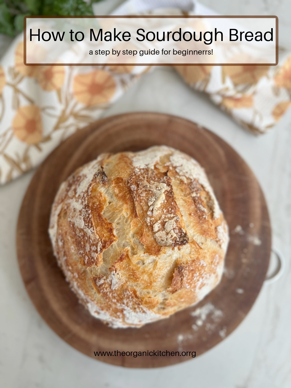 A loaf of sourdough bread on a wood cutting board: How to Make Sourdough Bread - A Beginners Guide