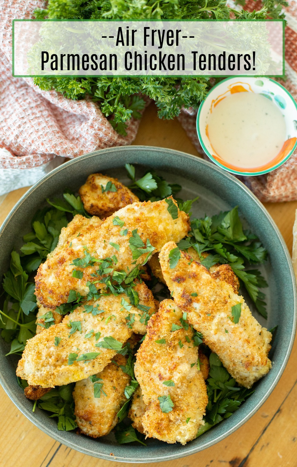 Air Fryer Parmesan Chicken Tenders garnished with parsley in a grey bowl