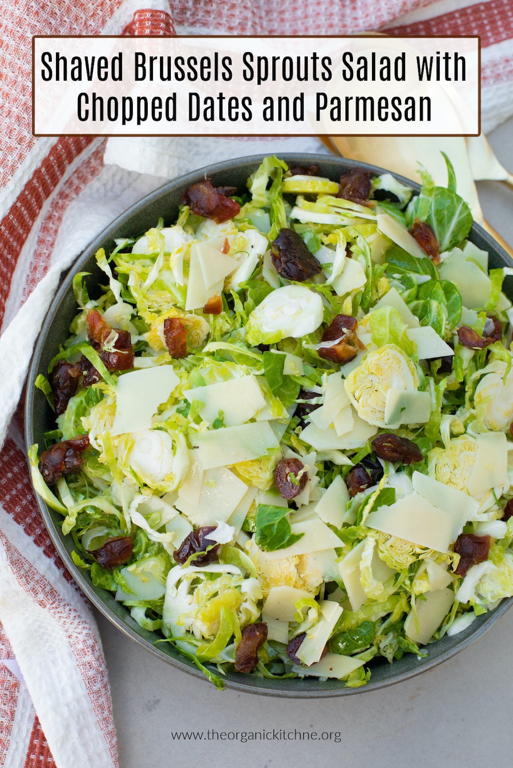 Shaved Brussels Sprouts and Date Salad in gray bowl with rust colored dish towel in background