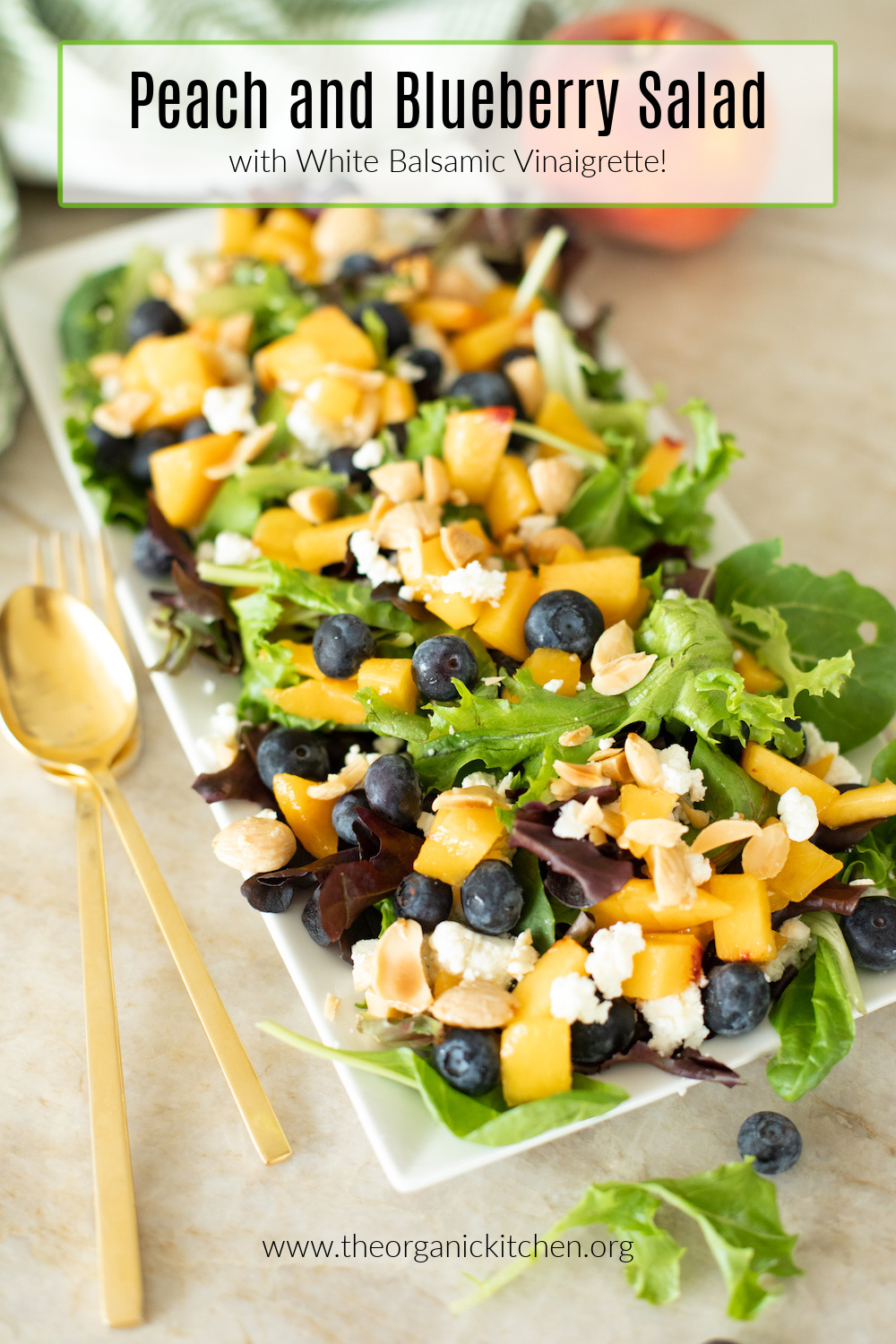 Peach and Blueberry Summer Salad on white platter with gold serving pieces
