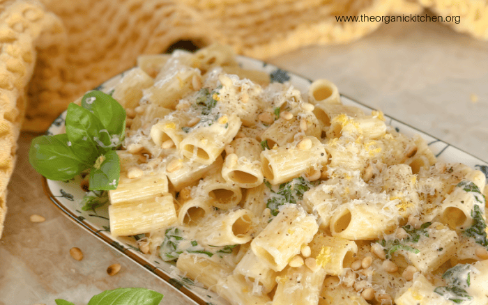 Creamy Lemon Rigatoni with Spinach Creamy Lemon Rigatoni with Spinach on plate with yellow dish towel in the background