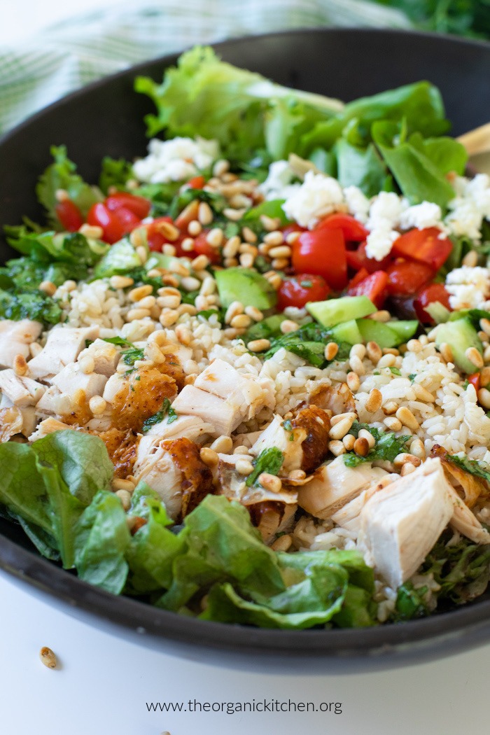 Chicken, Rice and Feta Salad in black ceramic bowl