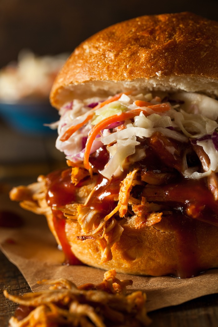 A close up of Crock Pot or Instant Pot BBQ Pulled Pork Sandwiches with creamy Irish Coleslaw