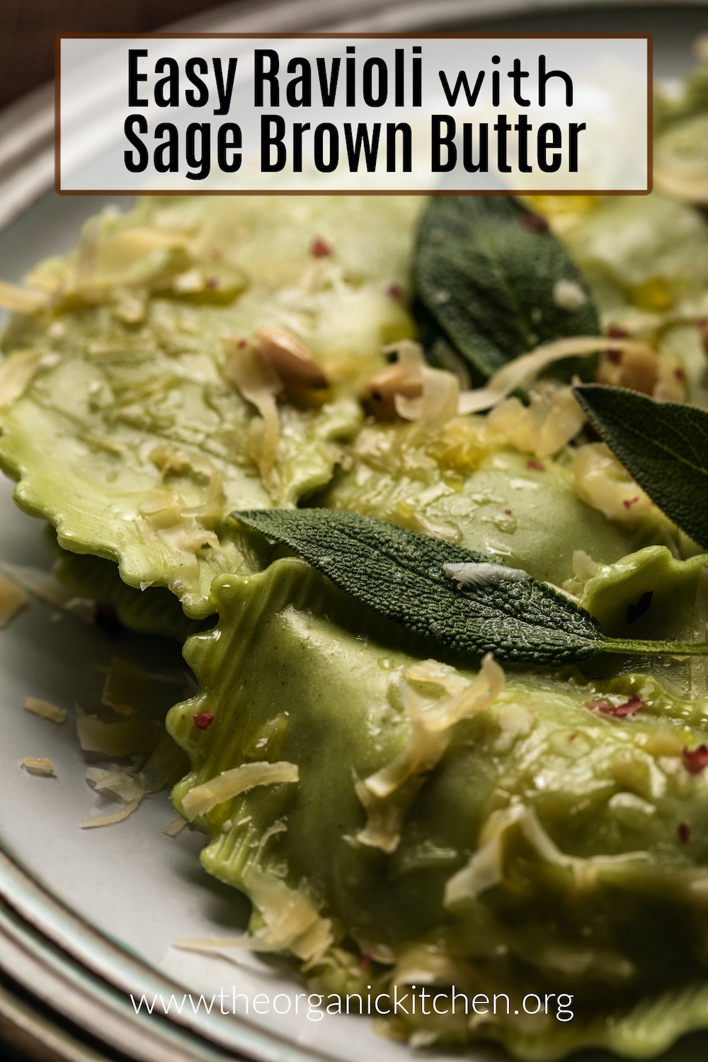 A close up photo of Easy Ravioli with Sage Brown Butter garnished with pine nuts on gray plate