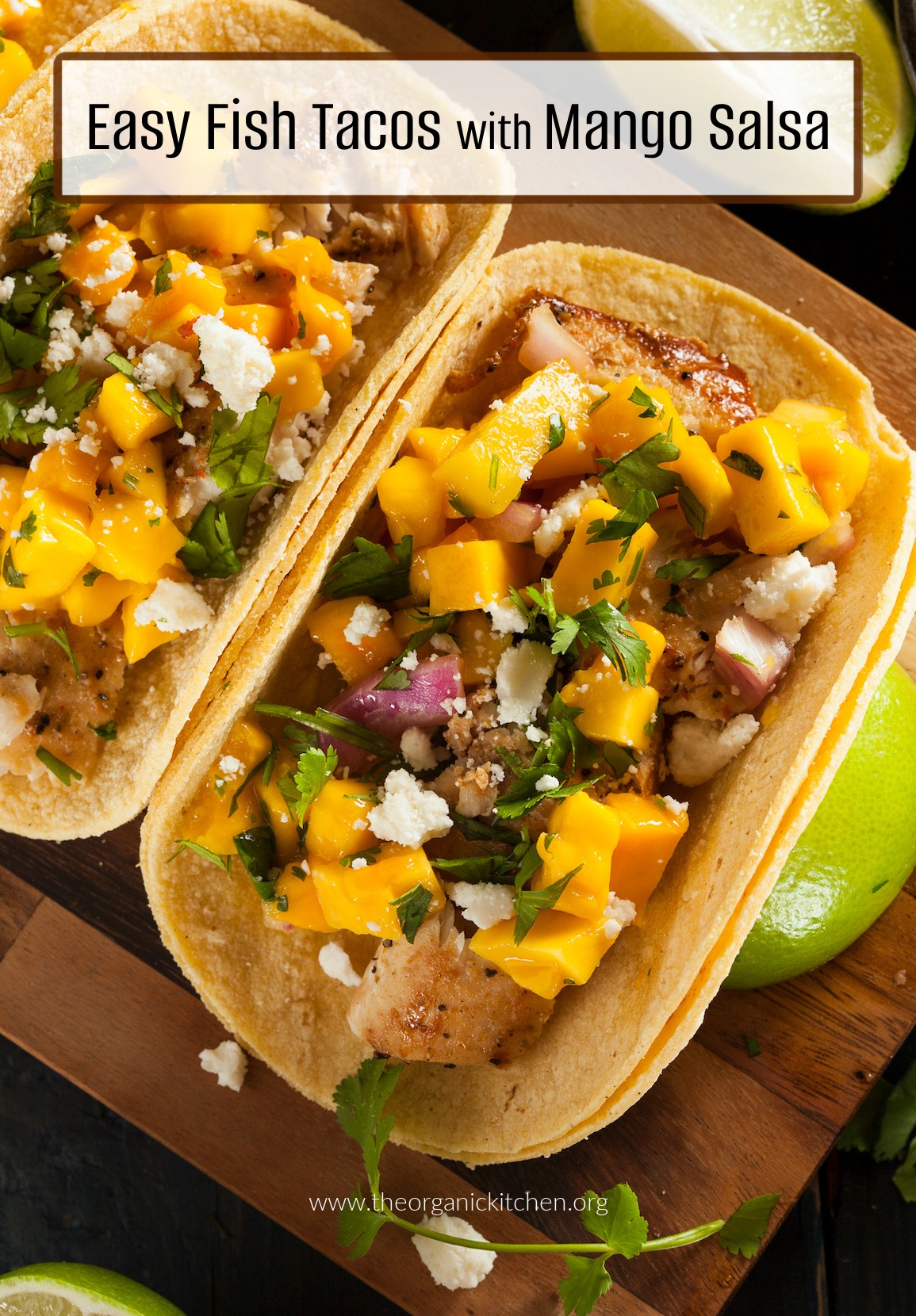 Easy Fish Tacos with Mango Salsa garnished with cilantro and lime wedges on wood cutting board