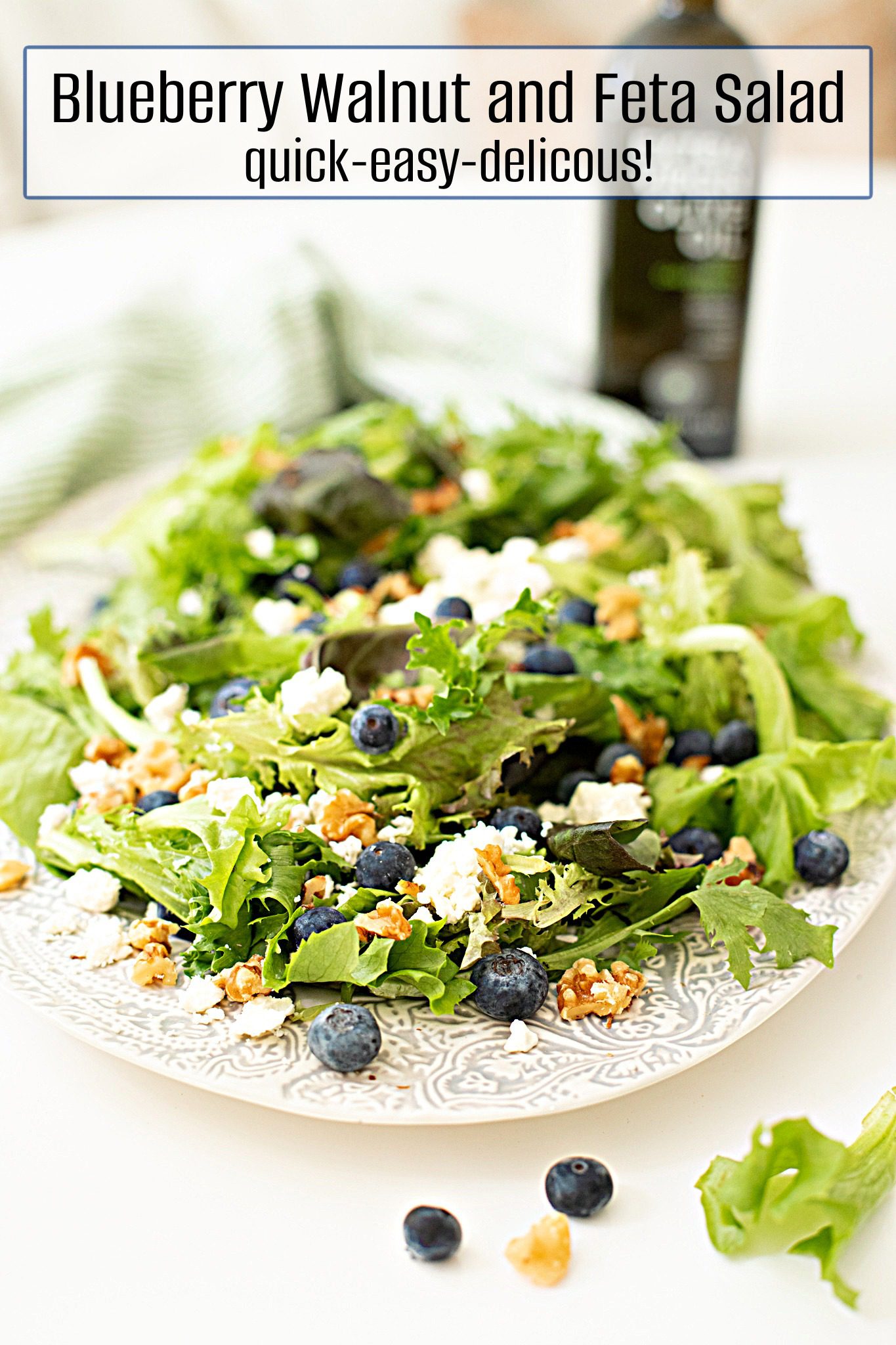 Blueberry, Walnut and Feta Salad Blueberry, Walnut and Feta Salad on white plate with a bottle of olive oil in the background