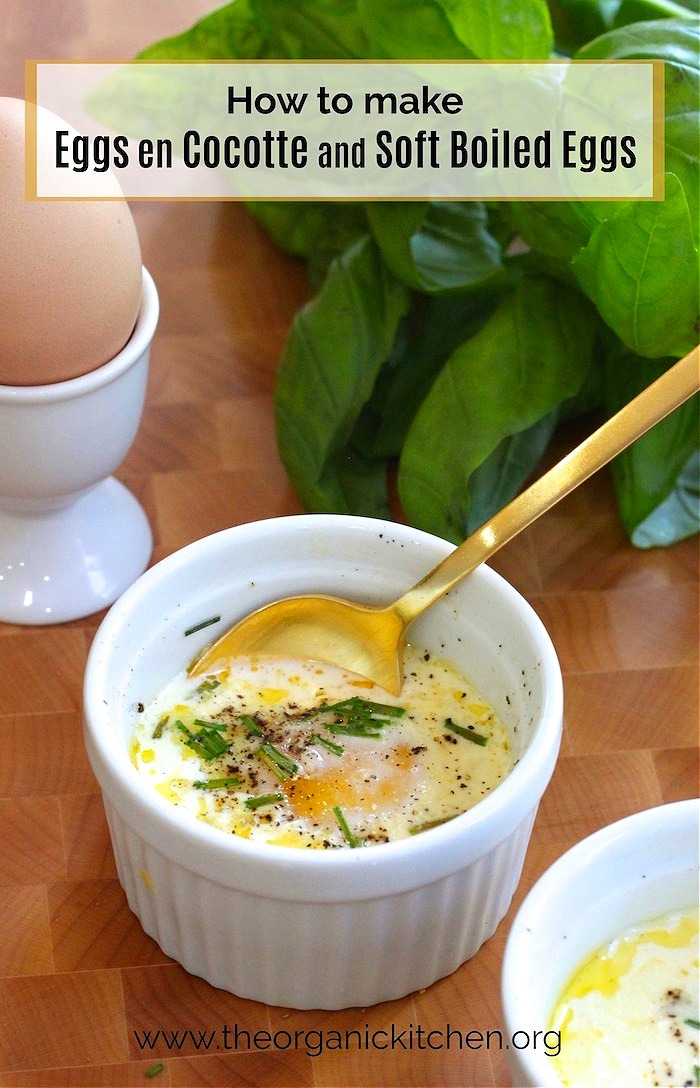 Eggs en Cocotte (Low Carb-Keto) in white ramekins on wooden board with basil in the background