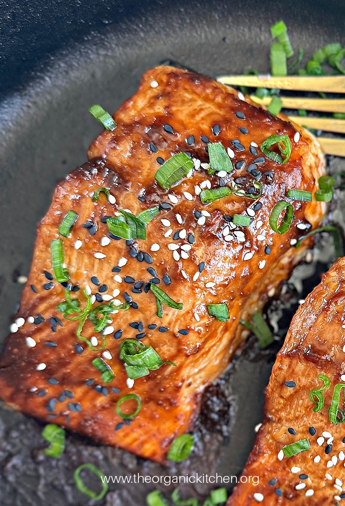 Easy Miso Glazed Salmon in a cast iron pan with gold fork