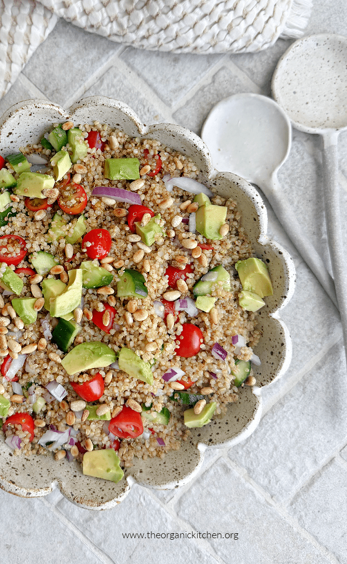 15 Recipes Using Cherry Tomatoes 15 Recipes Using Cherry Tomatoes: a quinoa salad in a bowl with serving spoons and dish towel to the side