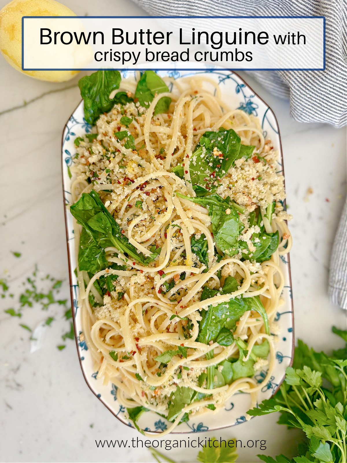 Browned Butter Linguine with Crispy Breadcrumbs garnished with parsley on blue and white platter