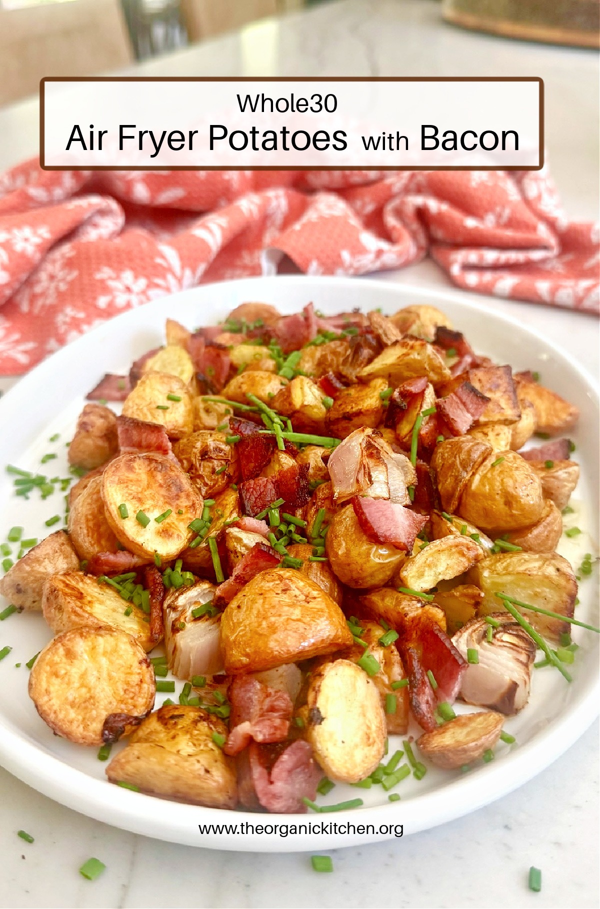 Air Fryer Potatoes with Bacon (Whole30) on white platter with red dish towel in background