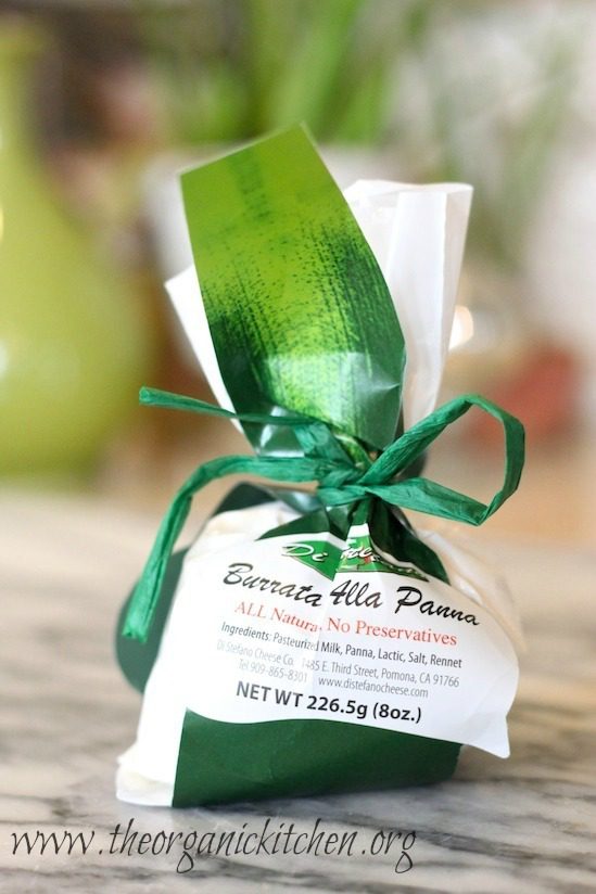 Burrata Cheese in a bag A green and white bag of burrata cheese tied with a green bow