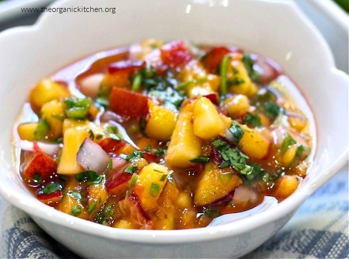 Fresh Peach Salsa Fresh Peach Salsa with cilantro in white flower petal bowl