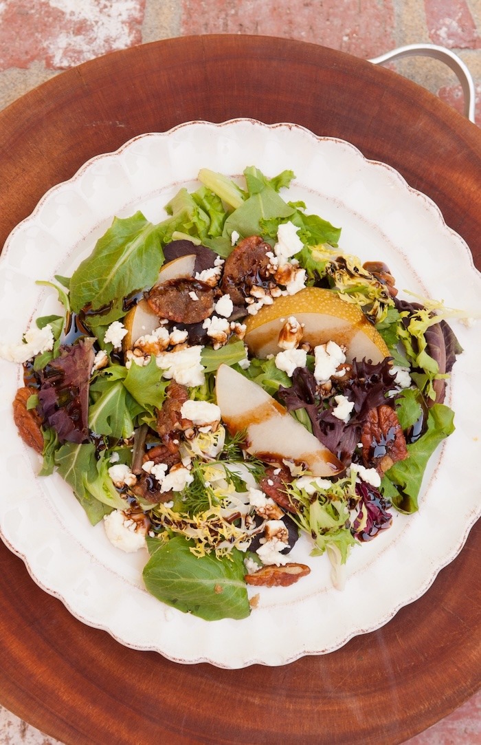 Greens with Asian Pears and Fig/Maple Balsamic on white plate
