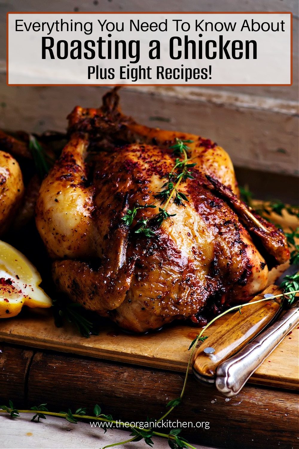 A roasted chicken garnished with thyme on a cutting board