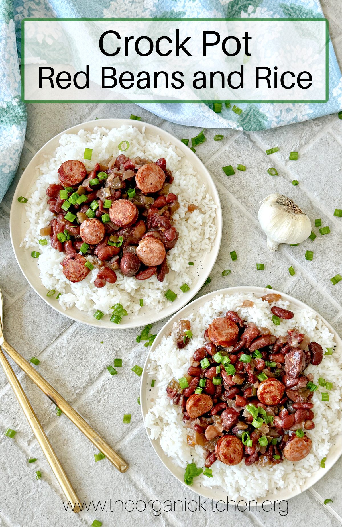 Crock Pot Red Beans and Rice Crock Pot Red Beans and Rice on two white plates with gold utensils, a dish towel and a head of garlic to the side