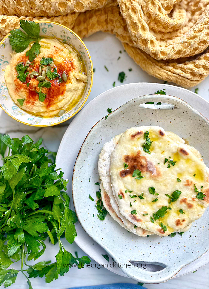 Easy Homemade Flatbread Easy Homemade Flatbread in agrey bowl with hummus and fresh herbs