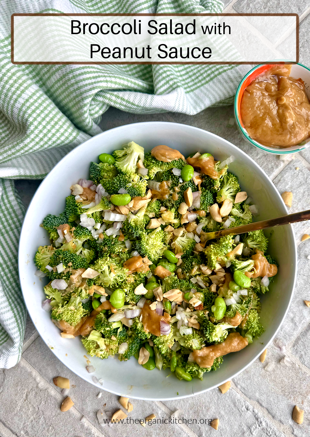 Broccoli Salad with Peanut Sauce Broccoli Salad with Peanut Sauce in white bowl wiih small bowl of peanut sauce and green and white dish towel in background