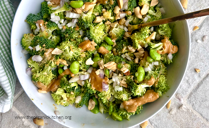 Broccoli Salad with Peanut Sauce Broccoli Salad with Peanut Sauce in white bowl with gold fork and scattered peanuts