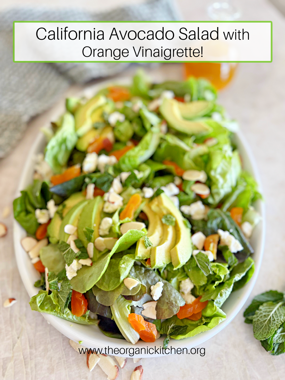 California Avocado Salad with Orange Vinaigrette California Avocado Salad with Orange Vinaigrette garnished with mint, feta, and almonds on white plate