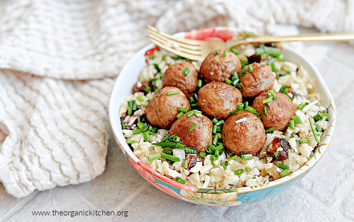Hungarian Meatballs with Cauliflower “Rice”~ Paleo, Whole30, Keto Hungarian Meatballs with Cauliflower “Rice”~ Paleo, Whole30, Keto in a colorful bowl with beige and white dish towel in the background