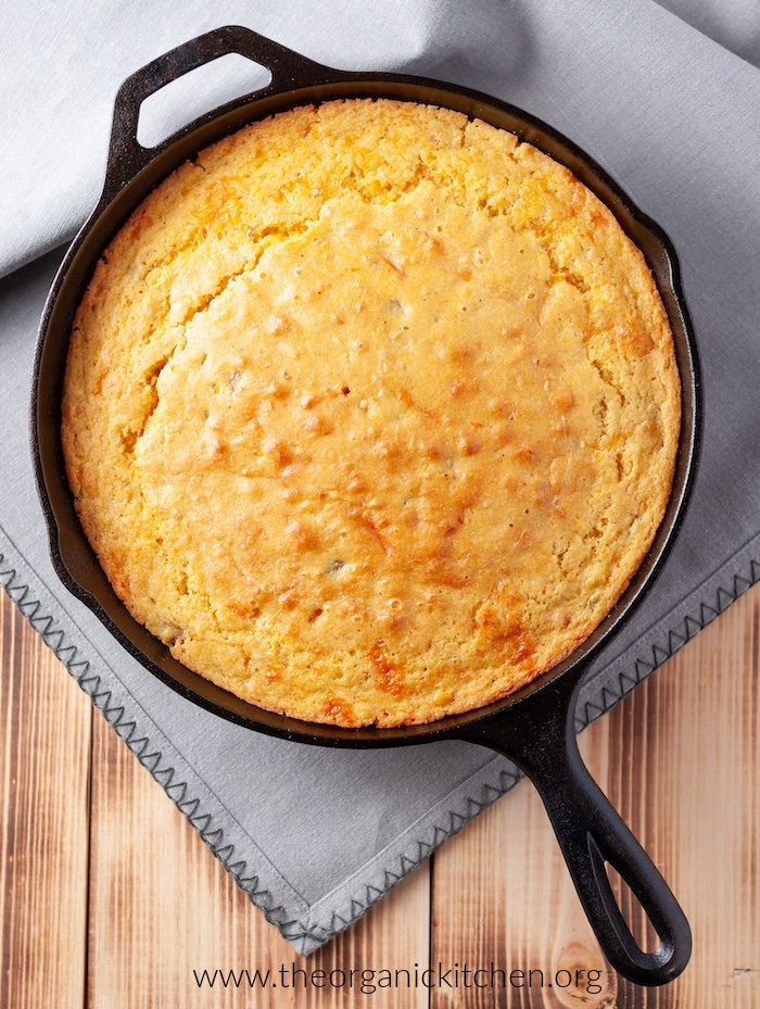 20 Easy Summer Side Dishes Cornbread in a black cast iron skillet on grey napkin