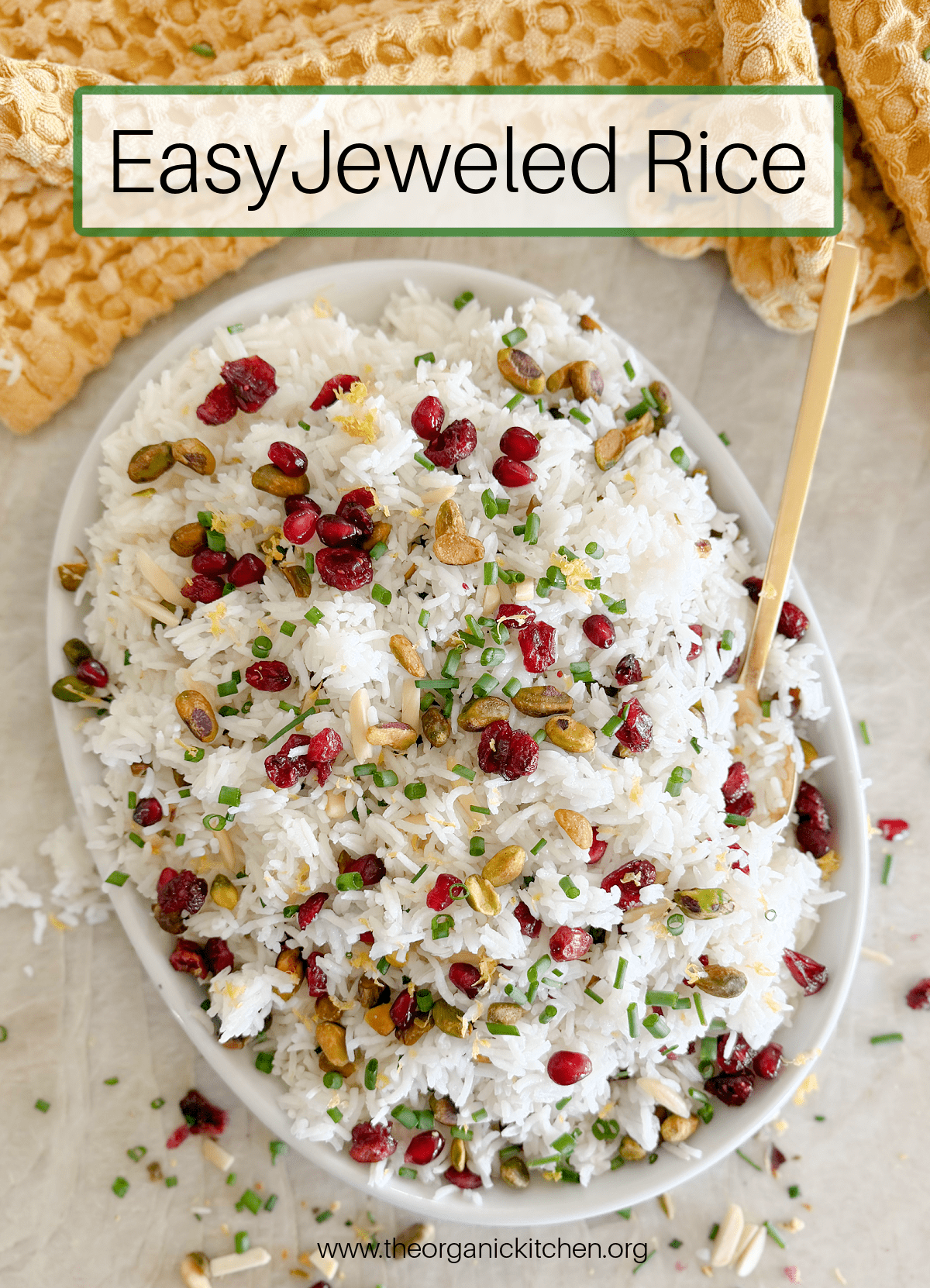 Easy Jeweled Rice Easy Jeweled Rice with pomegranates and chives on a white plate with a gold spoon and yellow dish towel