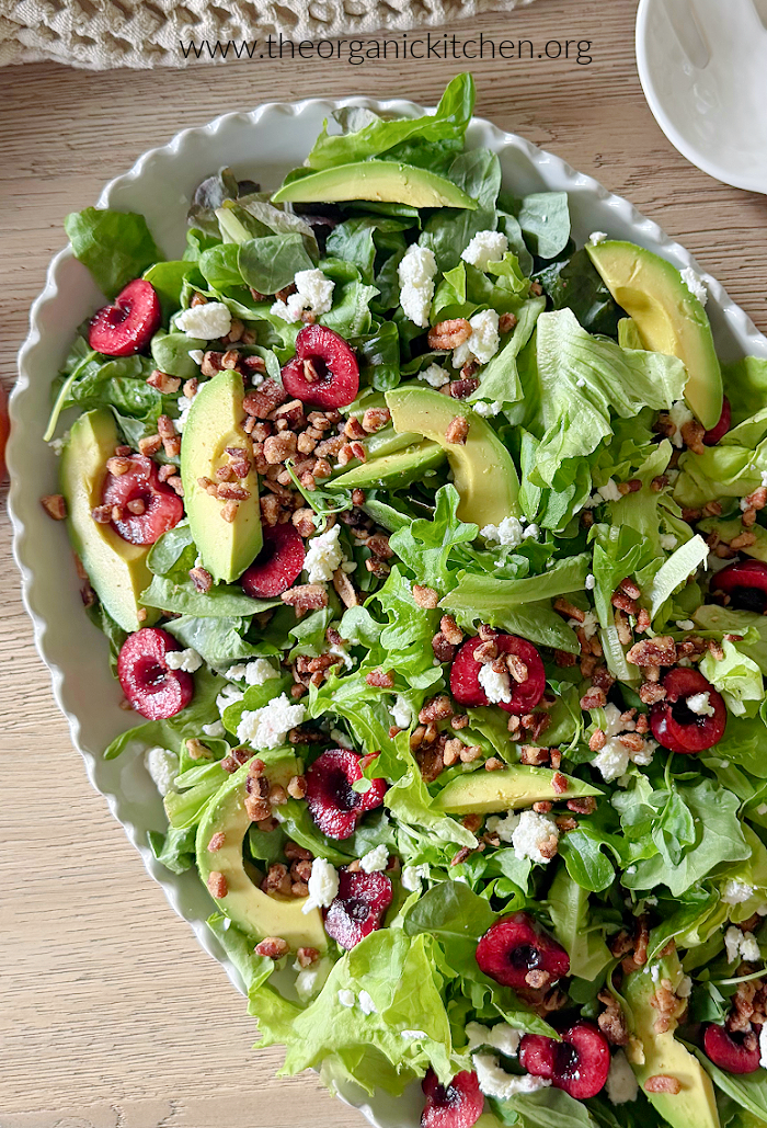 Cherry Goat Cheese Salad with Cherry Vinaigrette Cherry Goat Cheese Salad with Cherry Vinaigrette garnished with pecans on a white platter