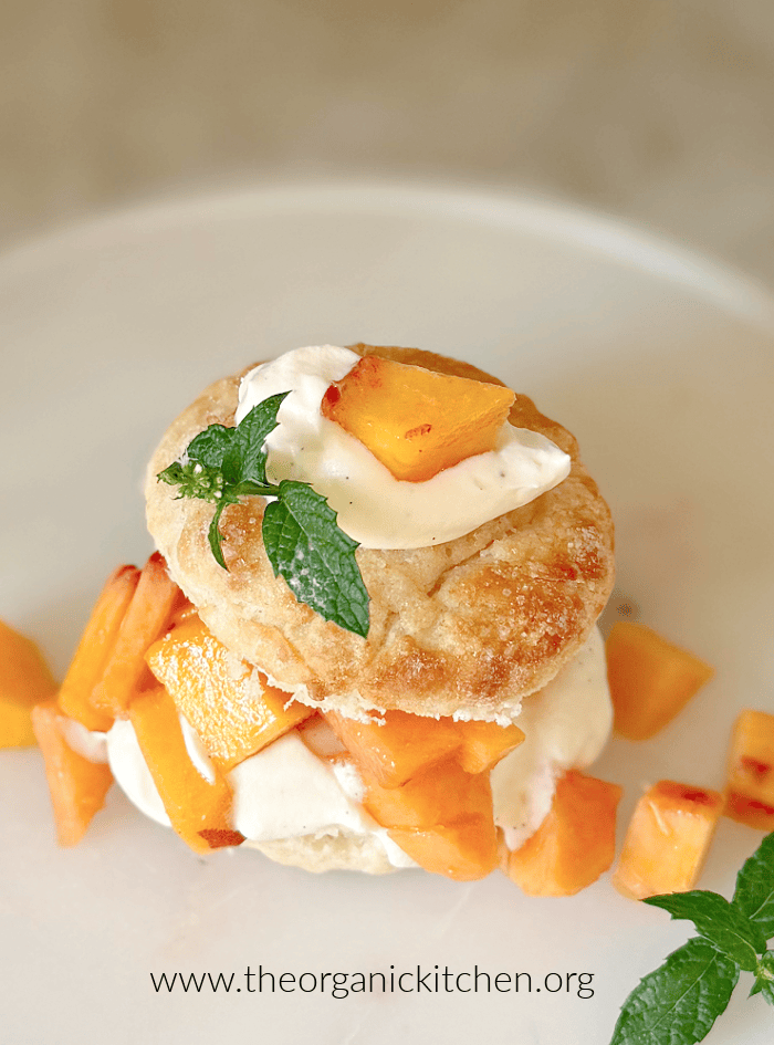 Old Fashioned Peach Shortcake Old Fashioned Peach Shortcake garnished with mint on a white plate