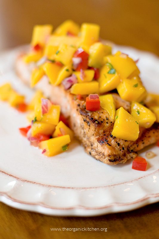 Salmon topped with mango salsa