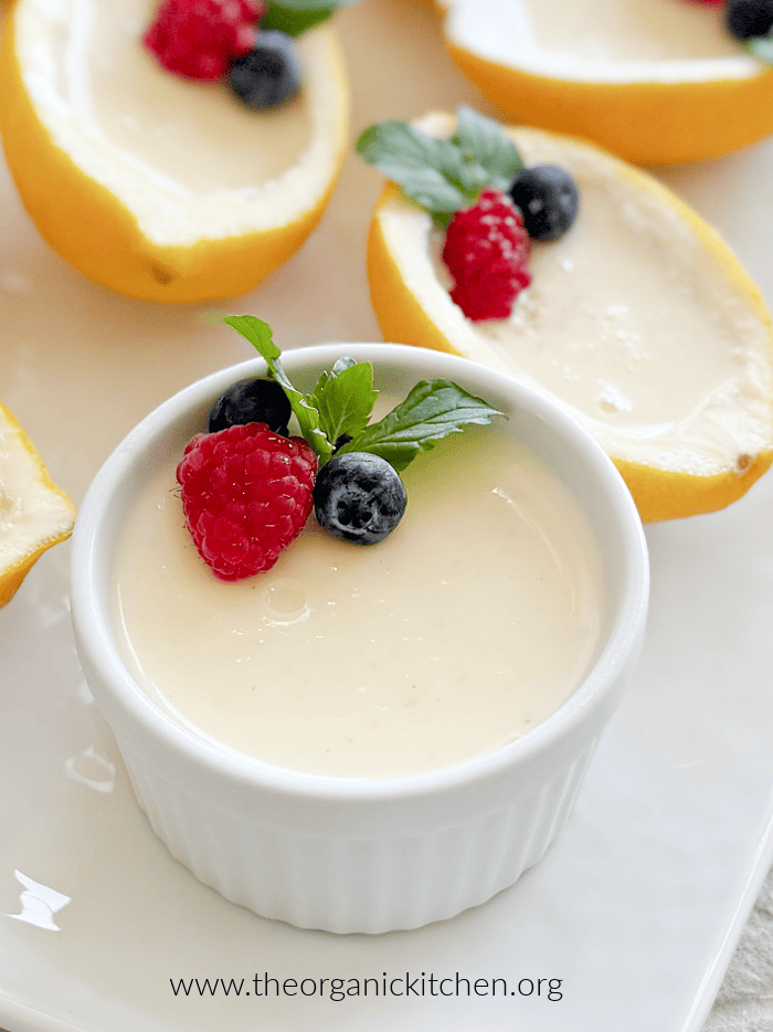 Easy Lemon Posset Easy Lemon Posset- lemon halves and ramekins filled with lemon custard garnished with mint and berries