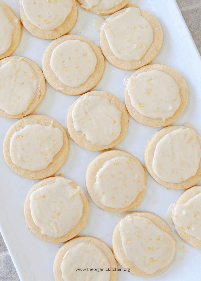 Simple Lemon Sugar Cookies on white tray Simple Lemon Sugar Cookies with icing on white tray