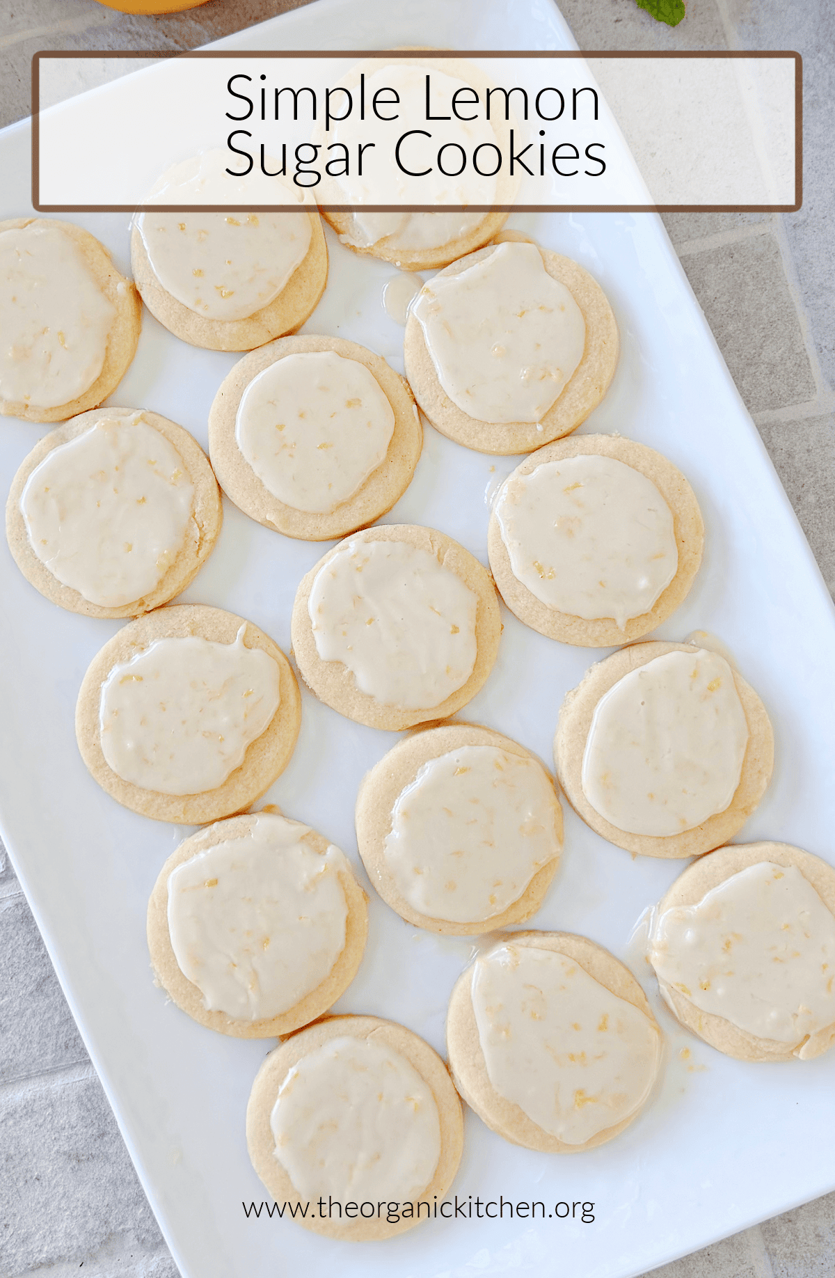 Simple Lemon Sugar Cookies Simple Lemon Sugar Cookies with lemon glaze on white tray