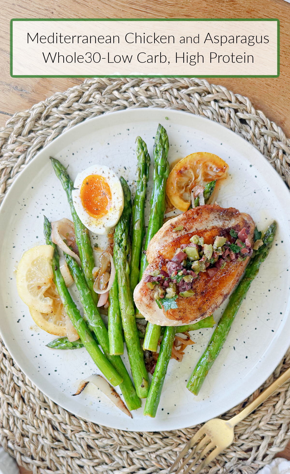 Mediterranean Chicken and Asparagus (Whole30) on a speckled plate set on a rattan place mat