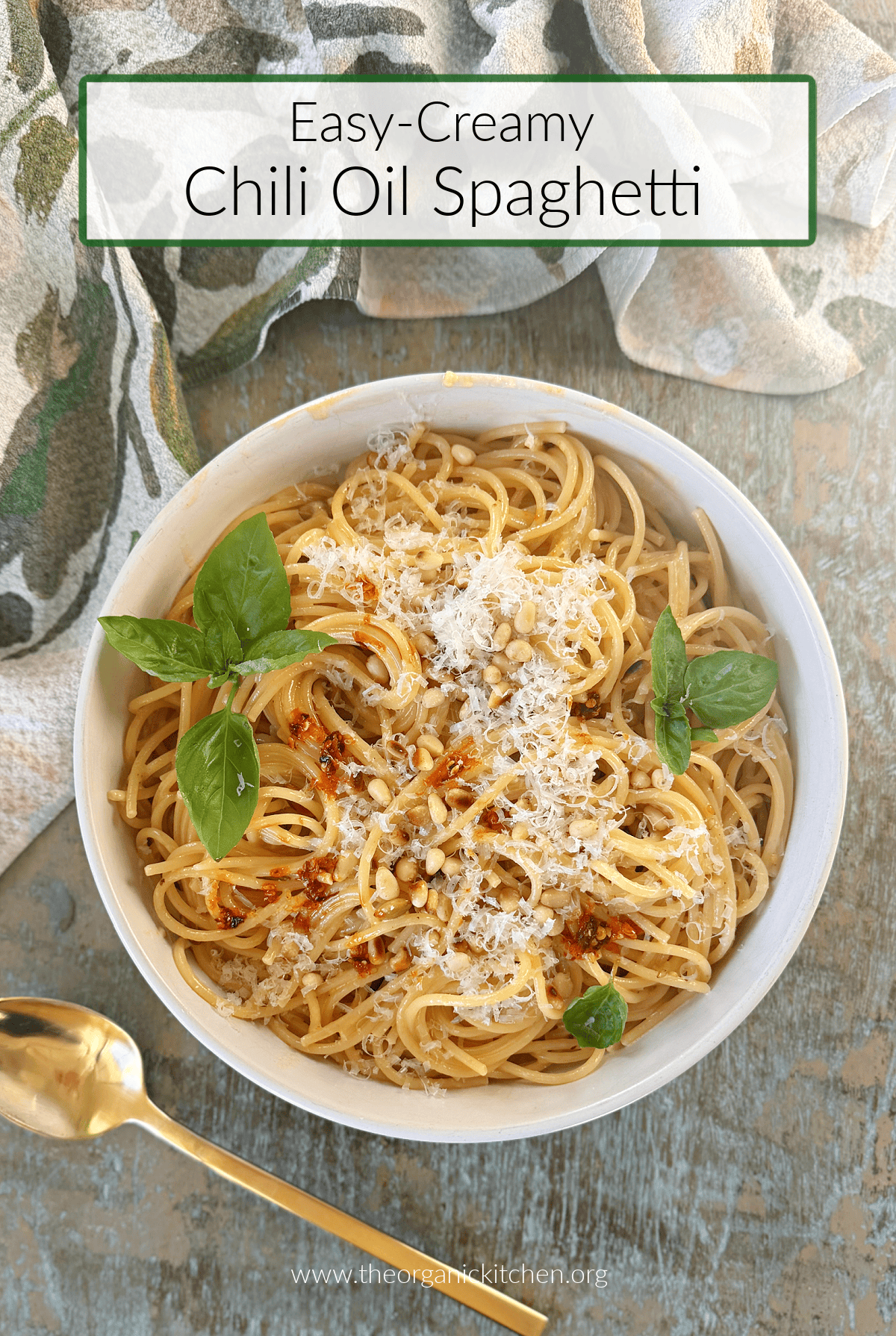 Easy Creamy Chili Oil Spaghetti Easy Creamy Chili Oil Spaghetti in a white bowl with dish towel and gold spoon on blue table