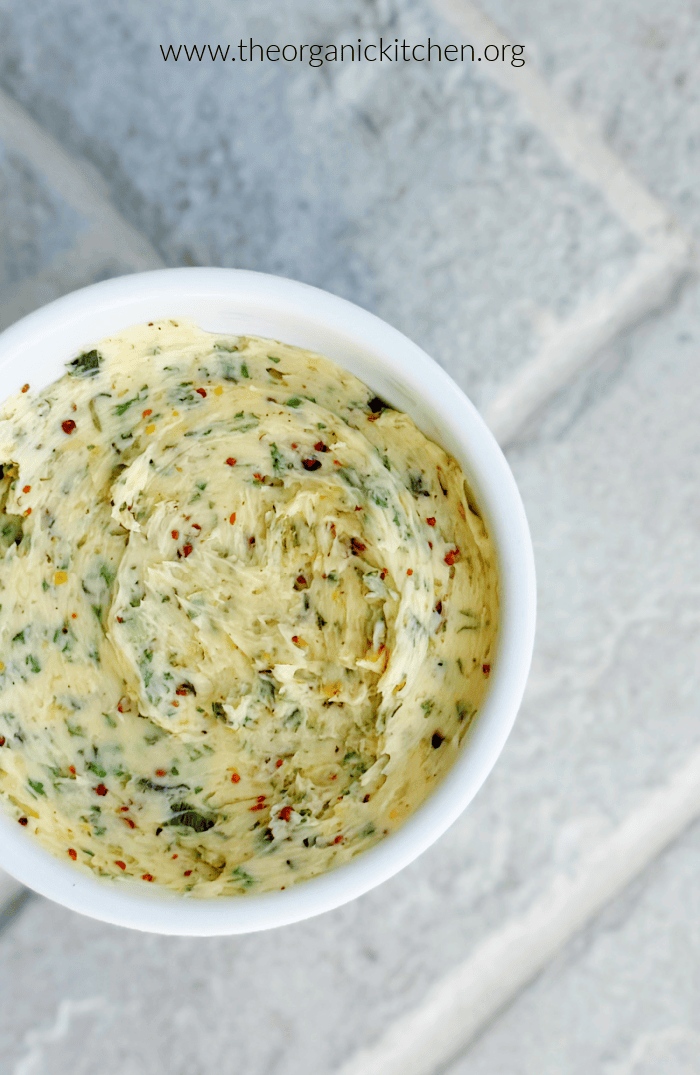 Cowboy Butter Steak Bites A ramekin filed with compund butter