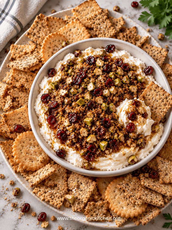 Whipped Cream Cheese with Warm Cranberries Whipped Cream Cheese with Warm Cranberries in white bowl with crackers
